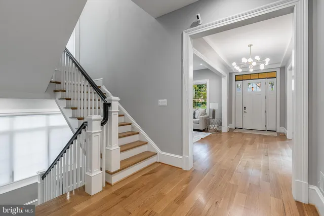 a view of a hallway view with wooden floor and entryway