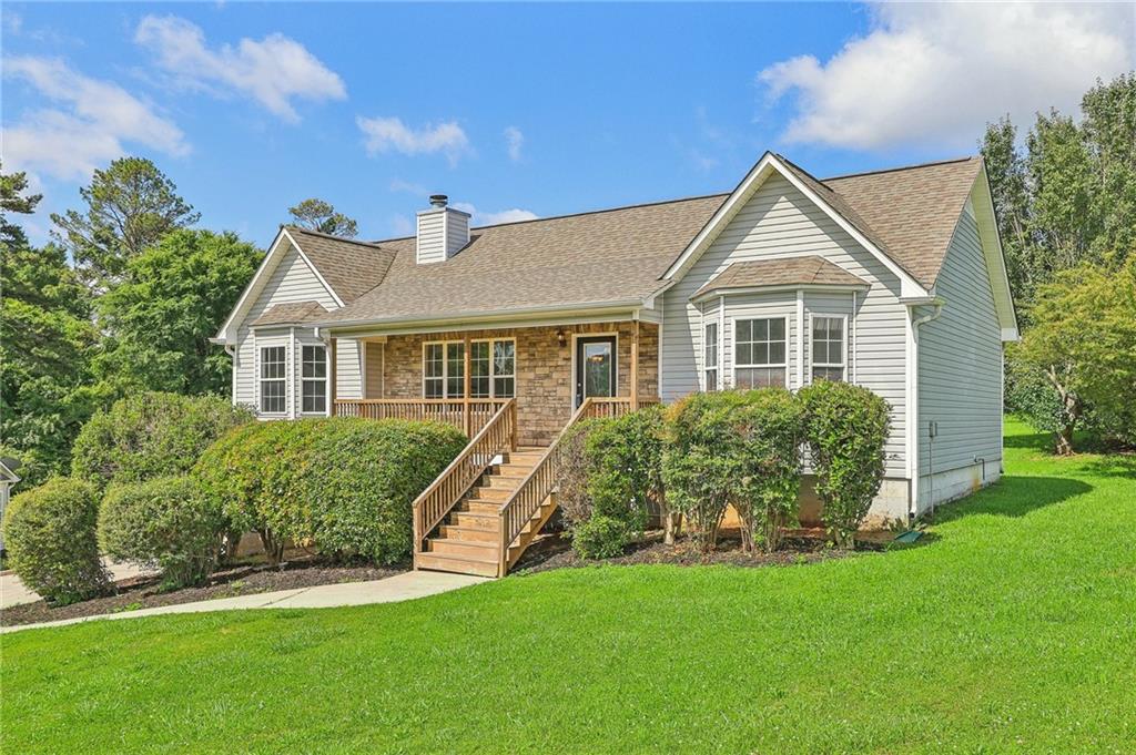 a front view of a house with a yard