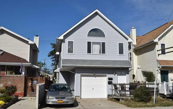a front view of a house with a garage