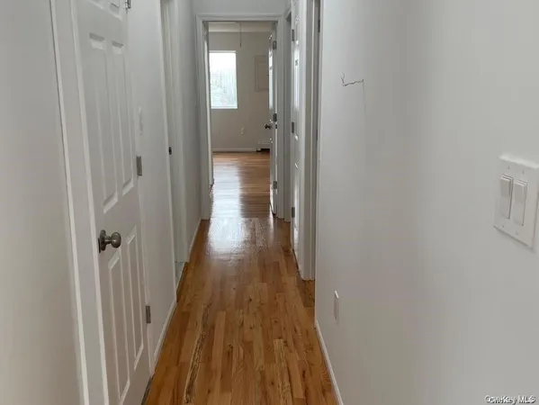 a view of a bathroom from the hallway