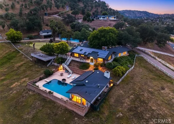 an aerial view of a house with a garden