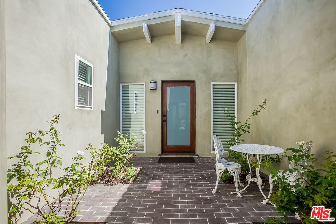18440 Coastline Drive Malibu, CA 90265 - Photo 4 of 21 a front view of a house with a yard