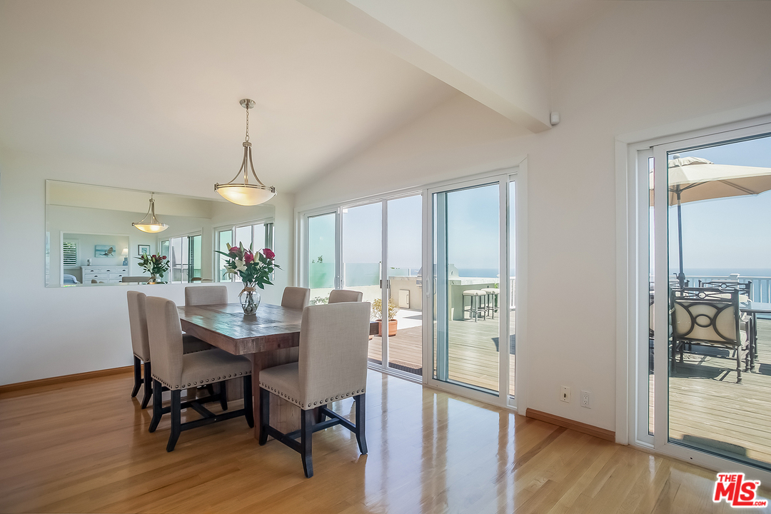 18440 Coastline Drive Malibu, CA 90265 - Photo 5 of 21 a view of a dining room with furniture window and wooden floor