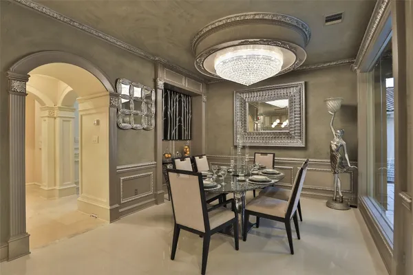 a dining room with furniture and window