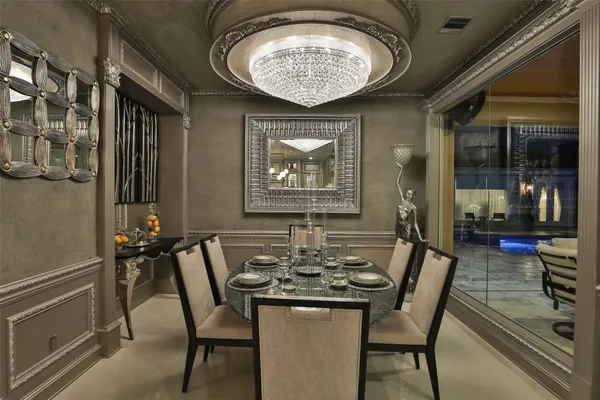 a kitchen with kitchen island a sink stainless steel appliances and cabinets