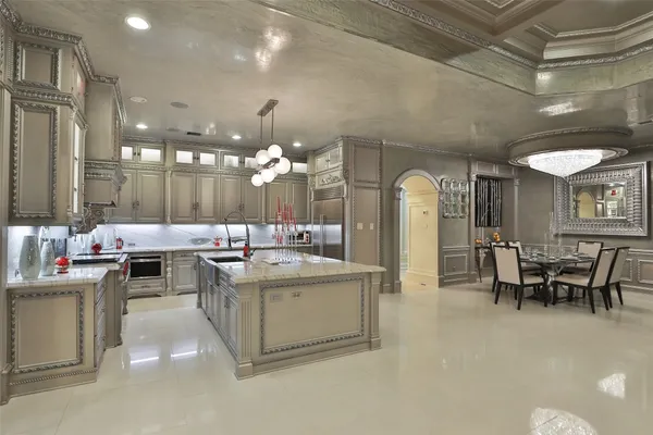 a bathroom with double vanity and a mirror