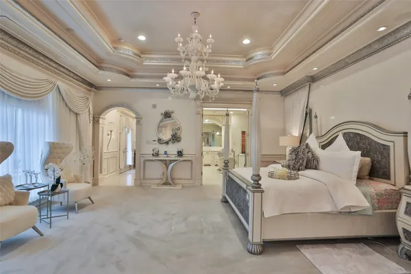 a spacious bathroom with a shower a sink and a mirror