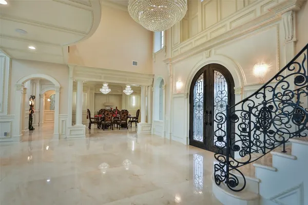 a very nice looking room with a large window and chandelier