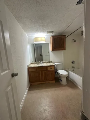 a bathroom with a double vanity sink a mirror and a toilet