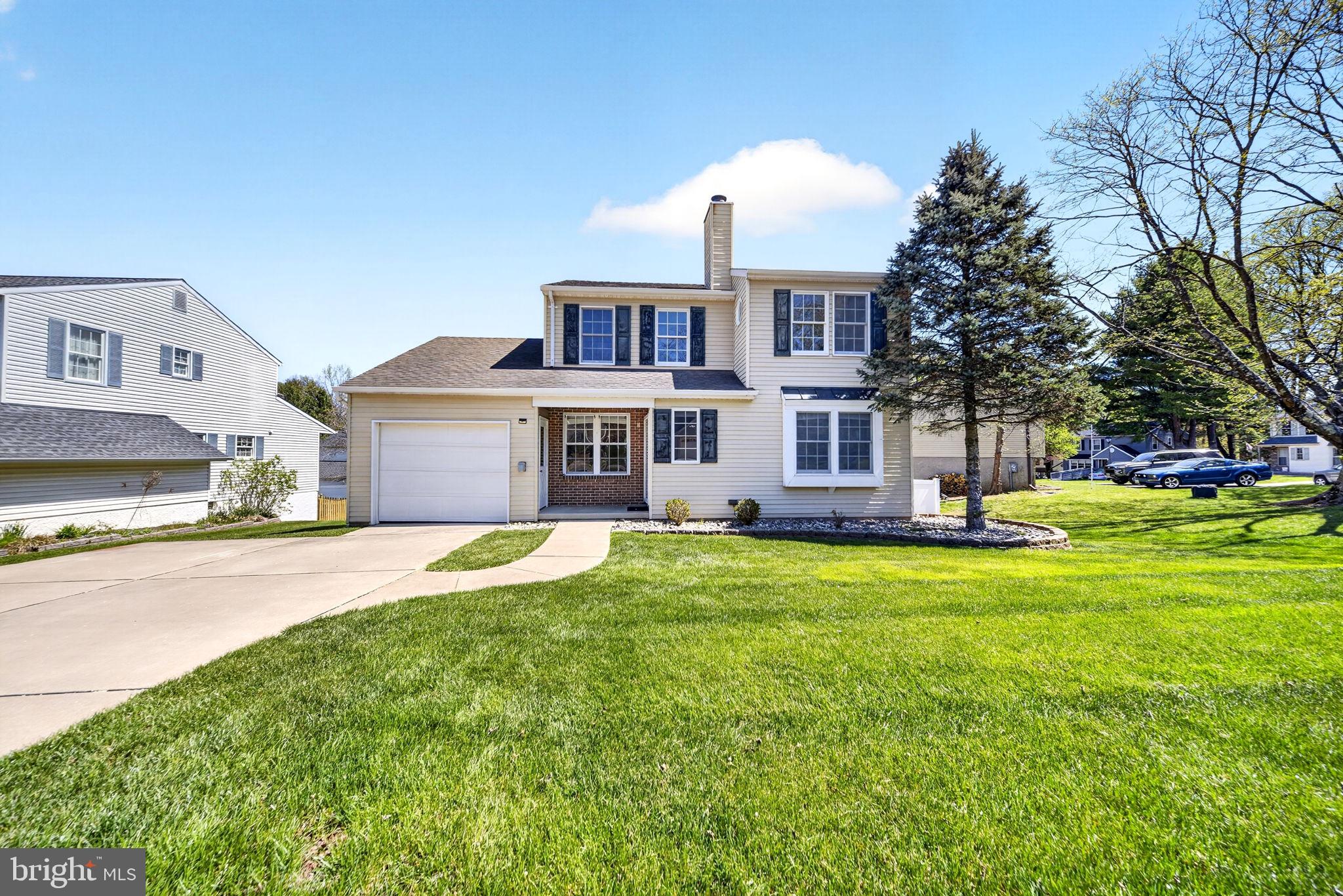 9331 Oak White Road Nottingham, MD 21236 - Photo 1 of 34 a front view of a house with a garden and yard