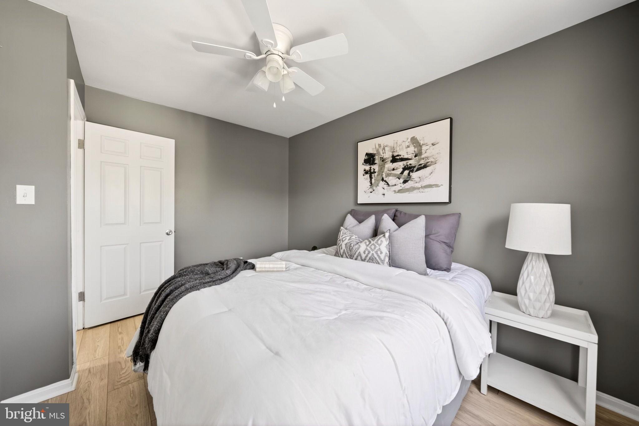 9331 Oak White Road Nottingham, MD 21236 - Photo 24 of 34 a bedroom with bed and a chandelier