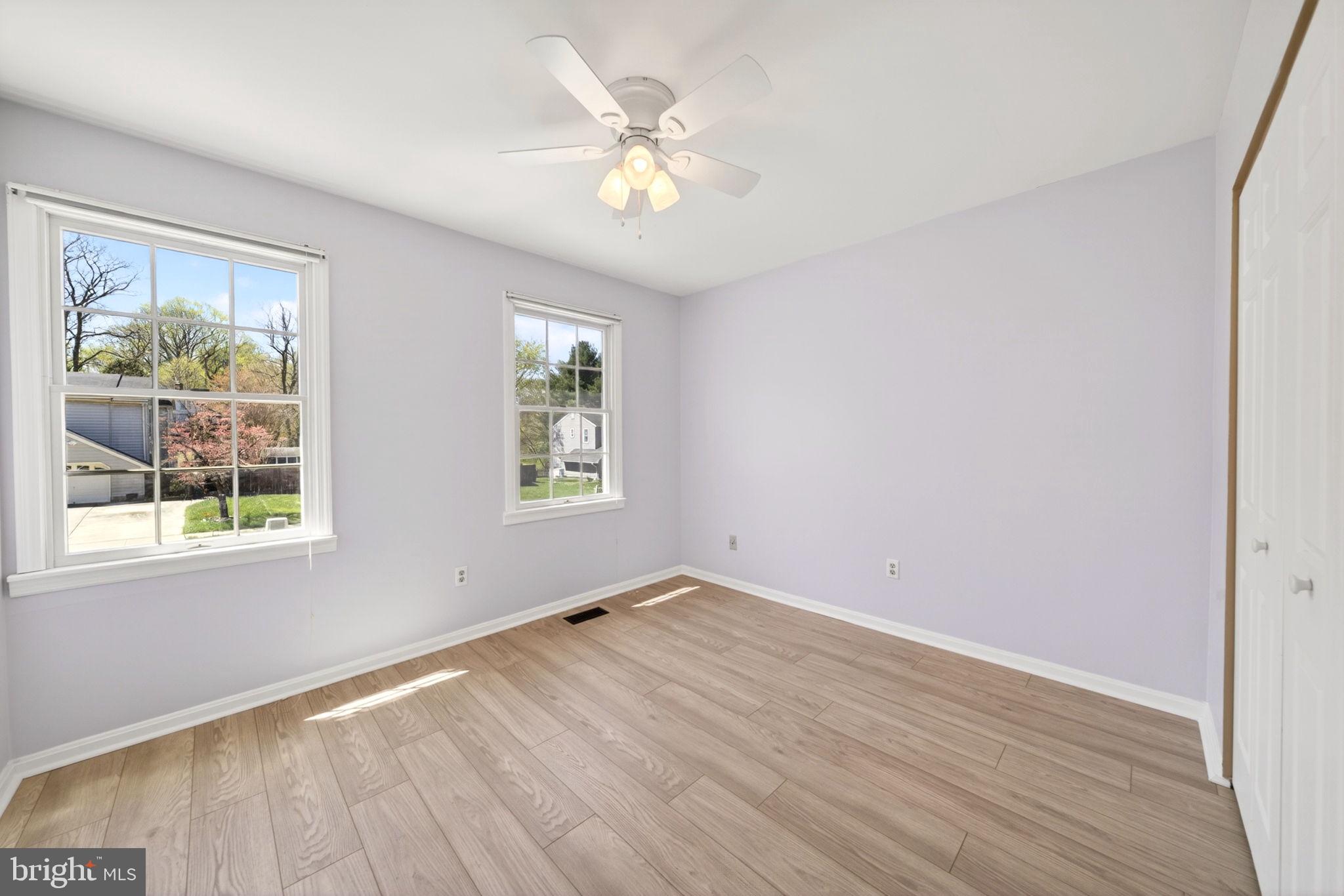 9331 Oak White Road Nottingham, MD 21236 - Photo 25 of 34 an empty room with wooden floor and windows