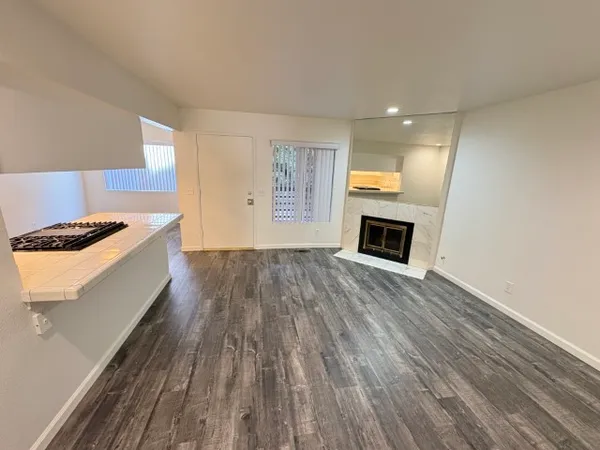a view of livingroom with hardwood floor and kitchen stove