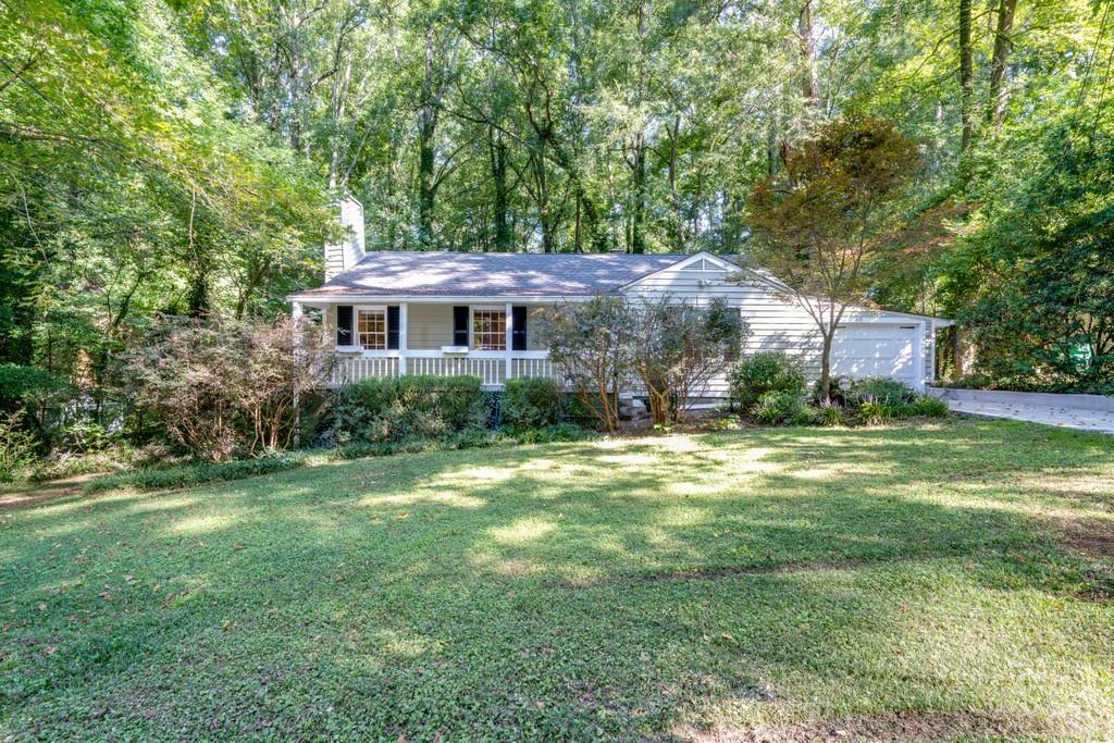 2356 Desmond Drive Decatur, GA 30033 - Photo 1 of 1 a front view of a house with a yard and large trees