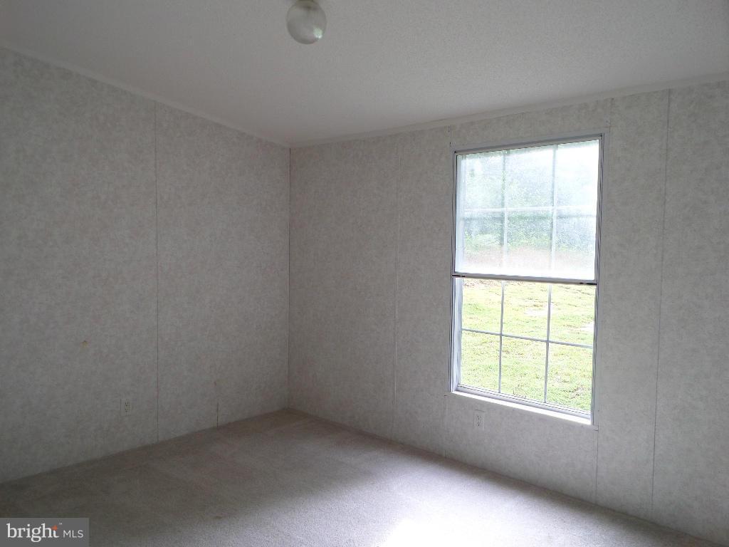 3640 Shirleys Hill Road Partlow, VA 22534 - Photo 22 of 25 an empty room with a window