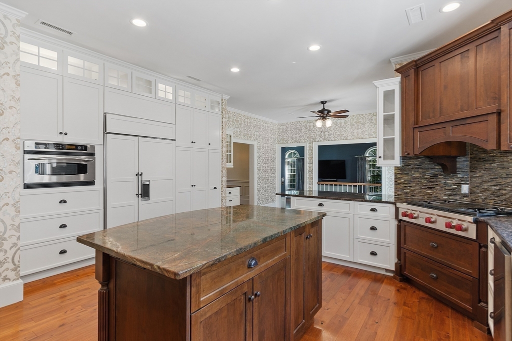 40 Grandview Road Chelmsford, MA 01824 - Photo 13 of 42 a kitchen with stainless steel appliances granite countertop a kitchen island a stove and a sink
