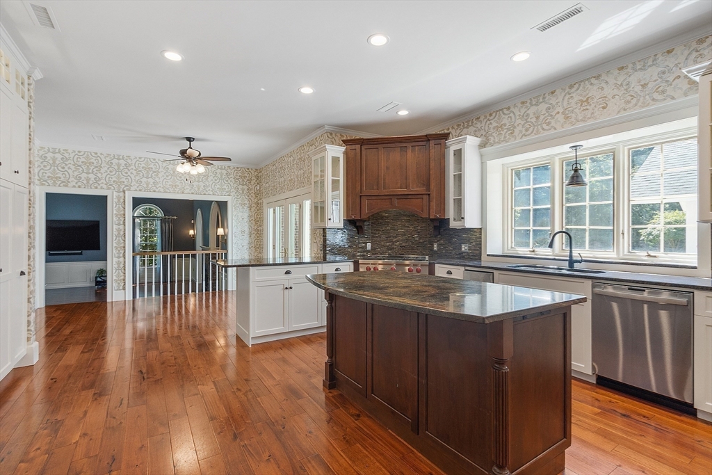 40 Grandview Road Chelmsford, MA 01824 - Photo 15 of 42 a kitchen with stainless steel appliances granite countertop a sink and wooden floors