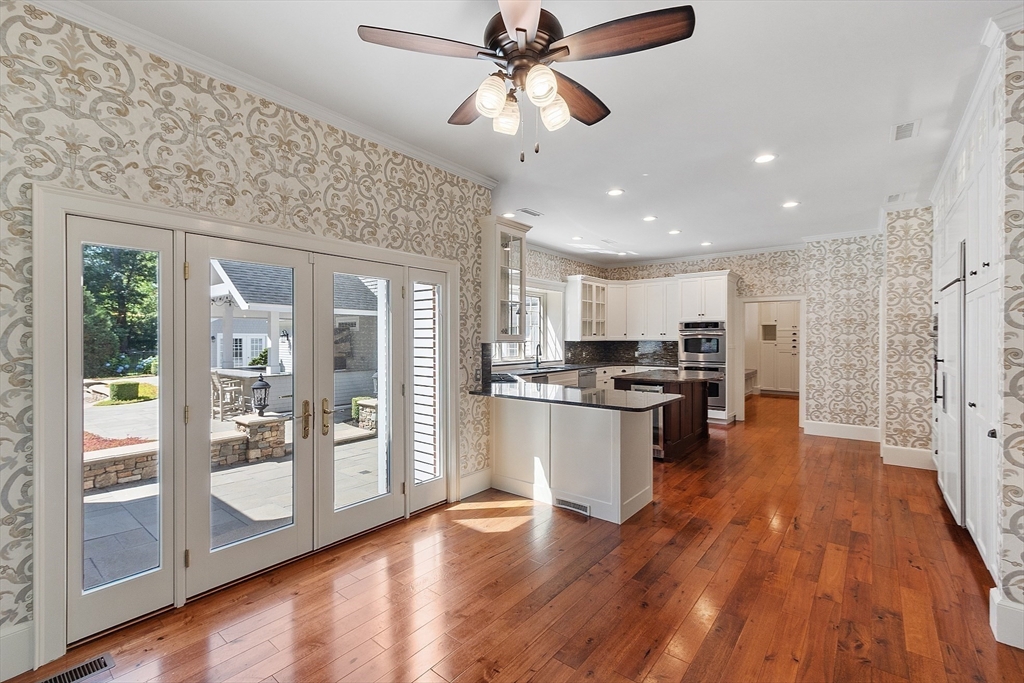 40 Grandview Road Chelmsford, MA 01824 - Photo 16 of 42 a kitchen with stainless steel appliances granite countertop a refrigerator a sink dishwasher a stove and white countertops with wooden floor
