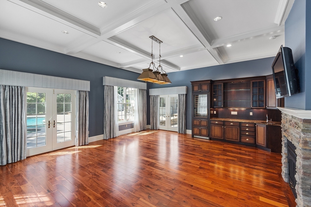40 Grandview Road Chelmsford, MA 01824 - Photo 19 of 42 a view of an empty room with window wooden floor and chandelier