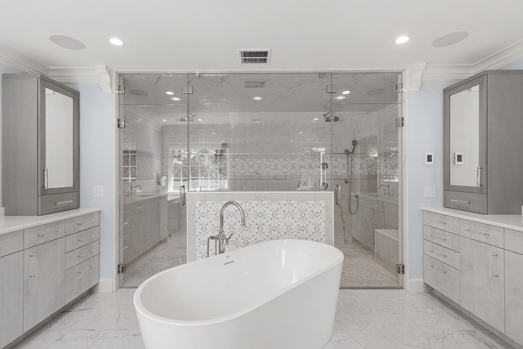 40 Grandview Road Chelmsford, MA 01824 - Photo 26 of 42 a bathroom with a bathtub shower sink and mirror