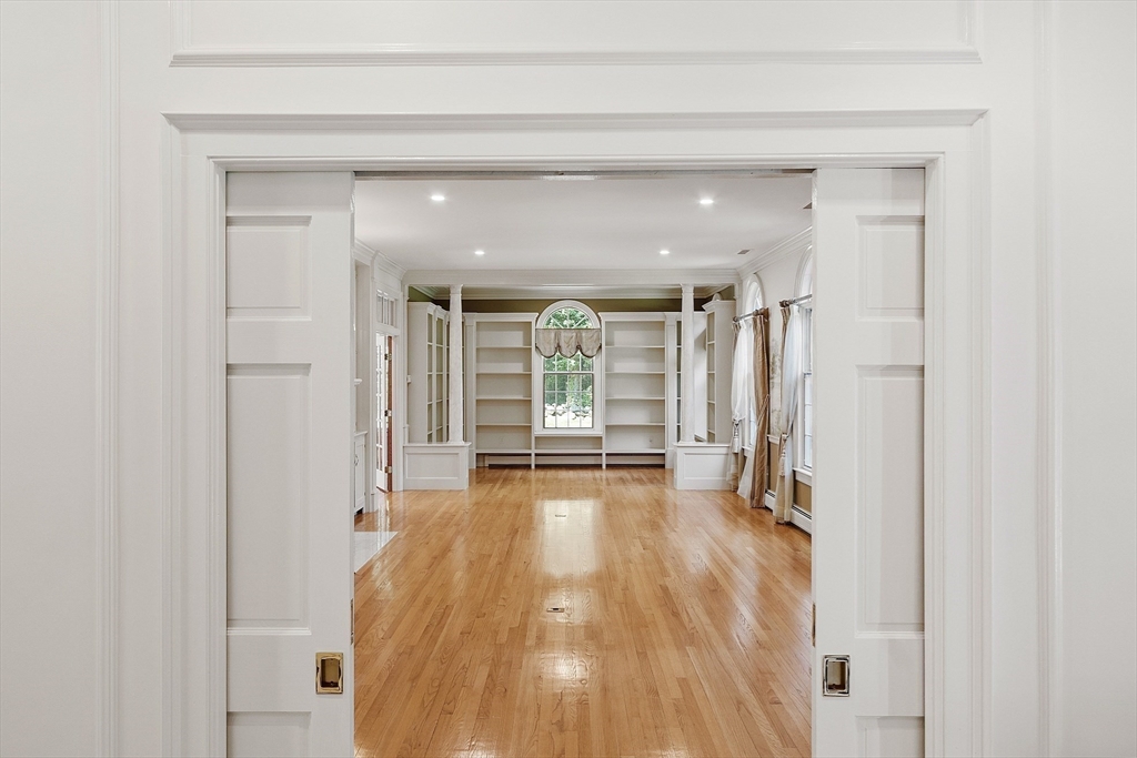 40 Grandview Road Chelmsford, MA 01824 - Photo 8 of 42 a view of a hallway with wooden floor and closet