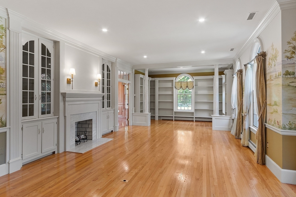 40 Grandview Road Chelmsford, MA 01824 - Photo 9 of 42 a view of an empty room with wooden floor and a window