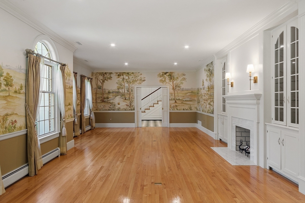 40 Grandview Road Chelmsford, MA 01824 - Photo 10 of 42 wooden floor in an empty room with a kitchen