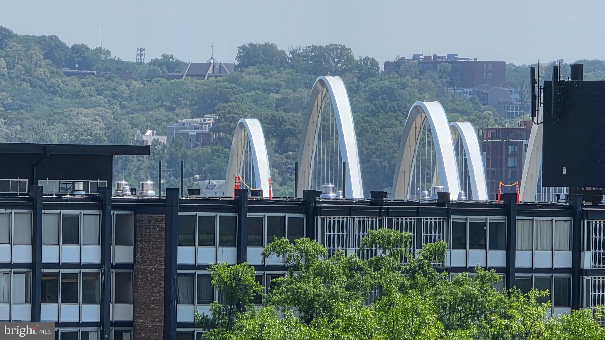490 M Street Southwest, Unit W705 & 709 Washington, DC 20024 - Photo 37 of 37 a view of a large building with a couple of cars parked in yard