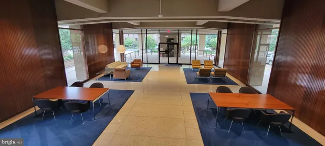 a room with pool table and windows