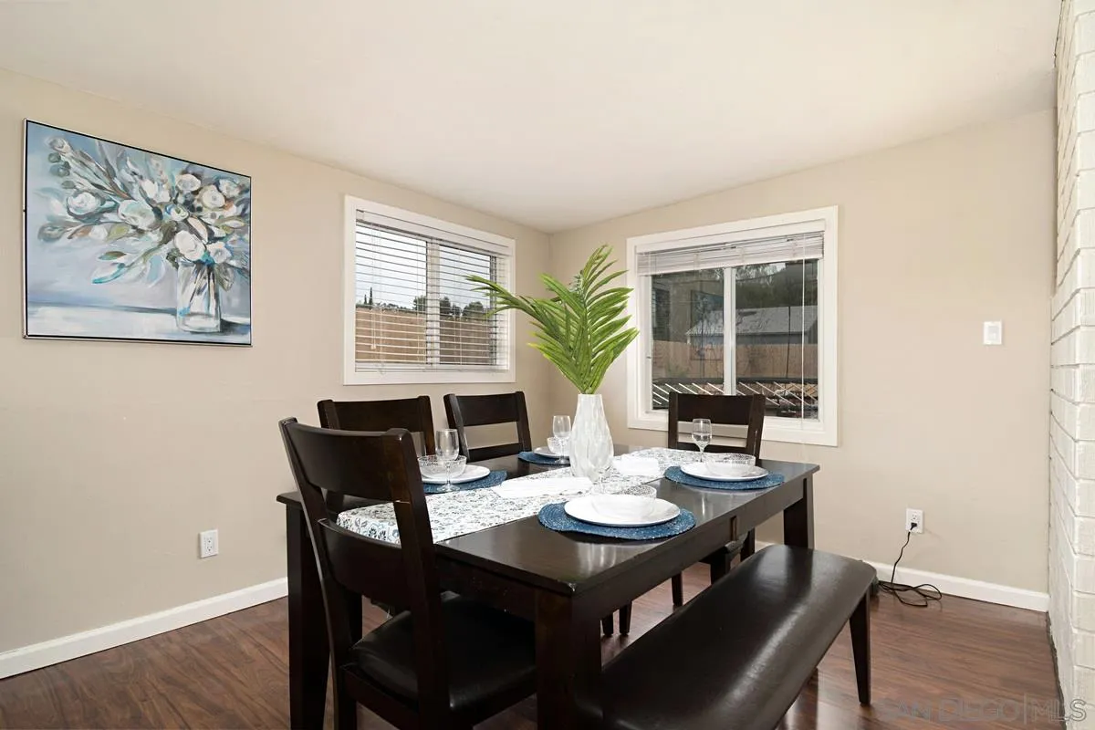 14112 Frame Road Poway, CA 92064 - Photo 12 of 30 a view of a dining room with furniture and wooden floor