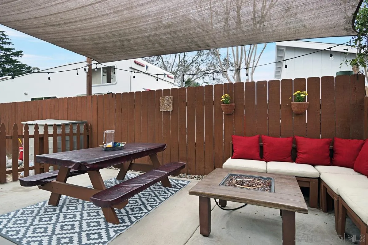 14112 Frame Road Poway, CA 92064 - Photo 26 of 30 a view of a patio with a table and chairs