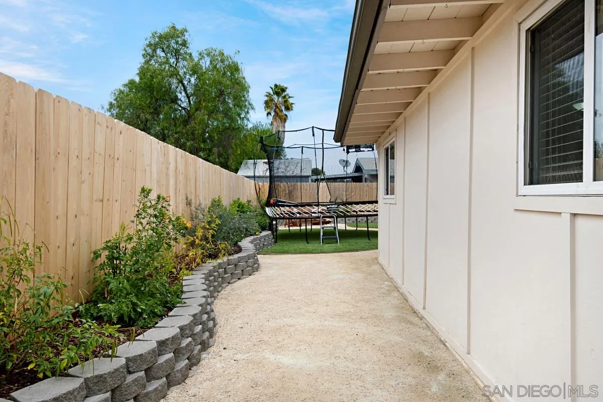 14112 Frame Road Poway, CA 92064 - Photo 27 of 30 a view of a pathway of a house with wooden fence