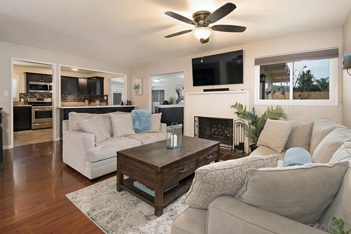 14112 Frame Road Poway, CA 92064 - Photo 4 of 30 a living room with furniture fireplace and flat screen tv