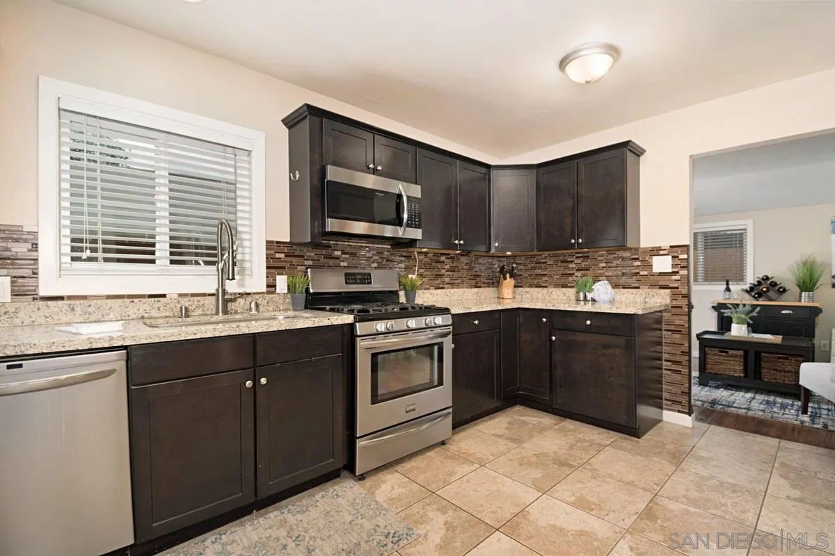 14112 Frame Road Poway, CA 92064 - Photo 8 of 30 a kitchen with a sink stove and microwave