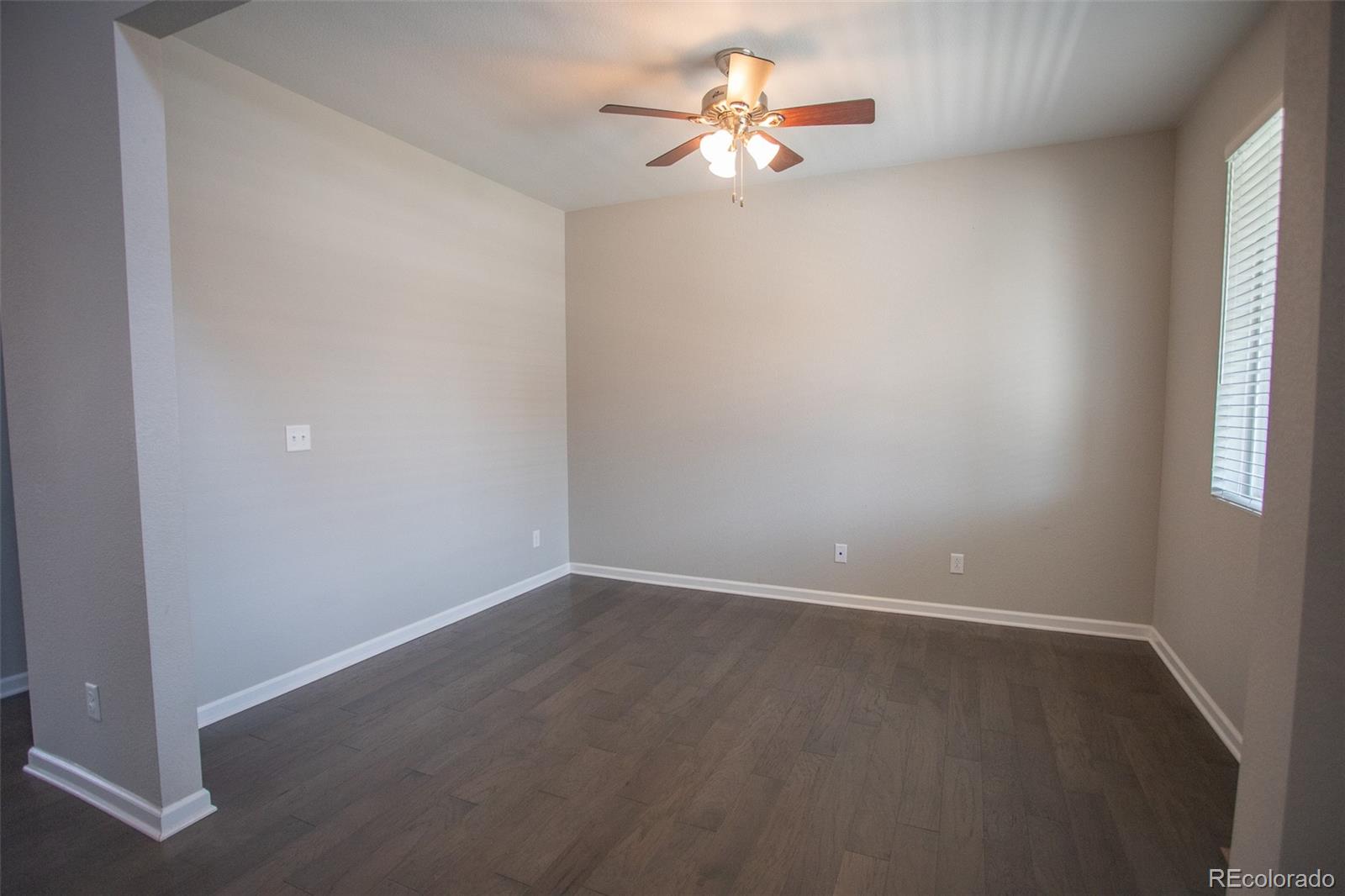 16343 East 100th Way Commerce City, CO 80022 - Photo 13 of 38 an empty room with a window