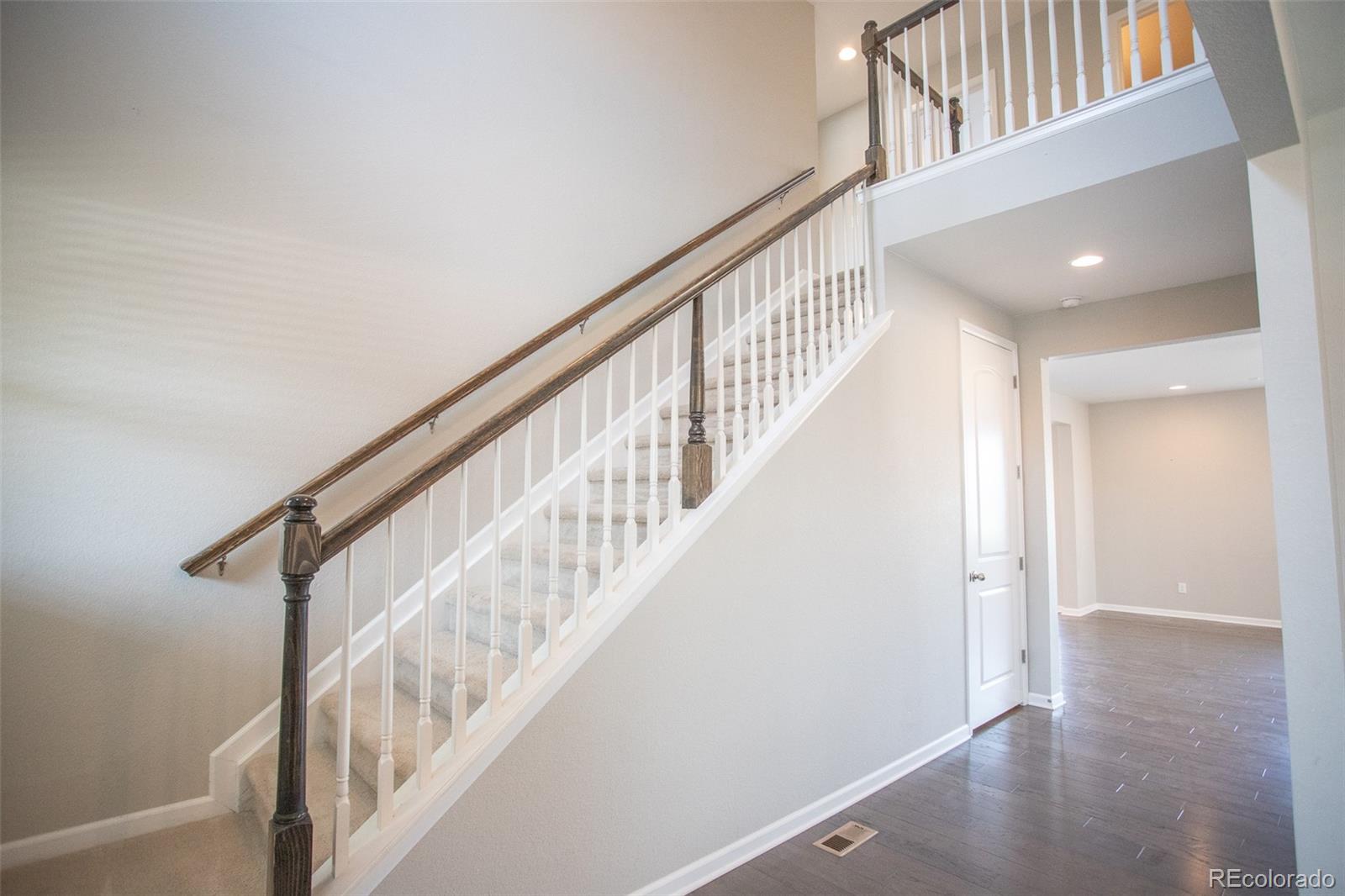 16343 East 100th Way Commerce City, CO 80022 - Photo 14 of 38 a view of entryway with wooden floor