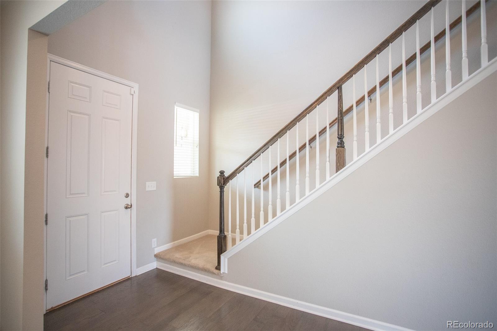 16343 East 100th Way Commerce City, CO 80022 - Photo 15 of 38 a view of an entryway with staircase