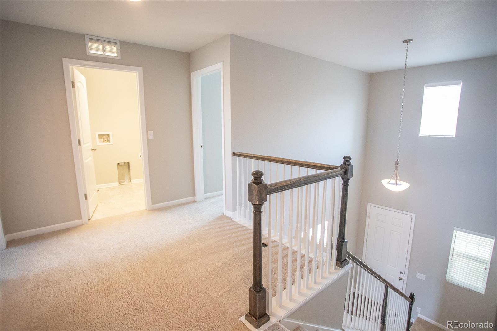 16343 East 100th Way Commerce City, CO 80022 - Photo 17 of 38 a view of a hallway with staircase