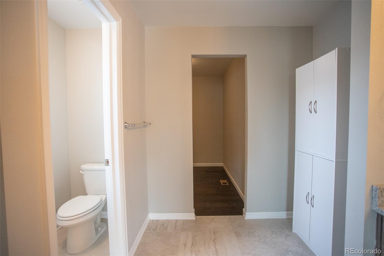 16343 East 100th Way Commerce City, CO 80022 - Photo 29 of 38 a bathroom with a sink and a toilet