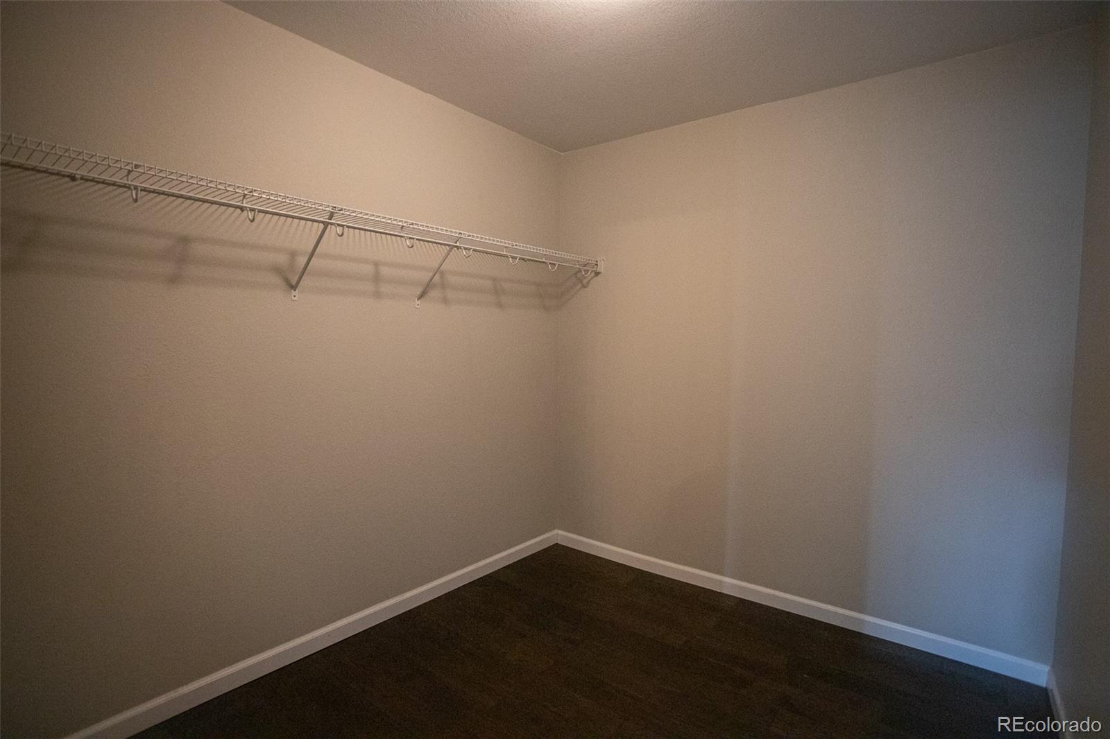 16343 East 100th Way Commerce City, CO 80022 - Photo 30 of 38 a view of a room with racks on the wall