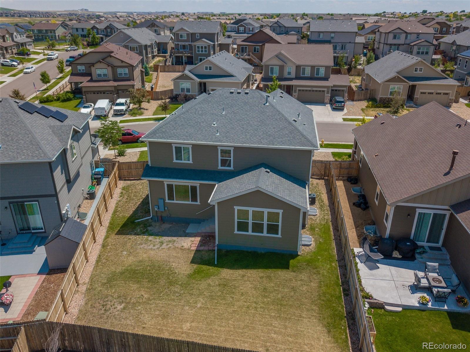 16343 East 100th Way Commerce City, CO 80022 - Photo 3 of 38 a aerial view of a house with a yard