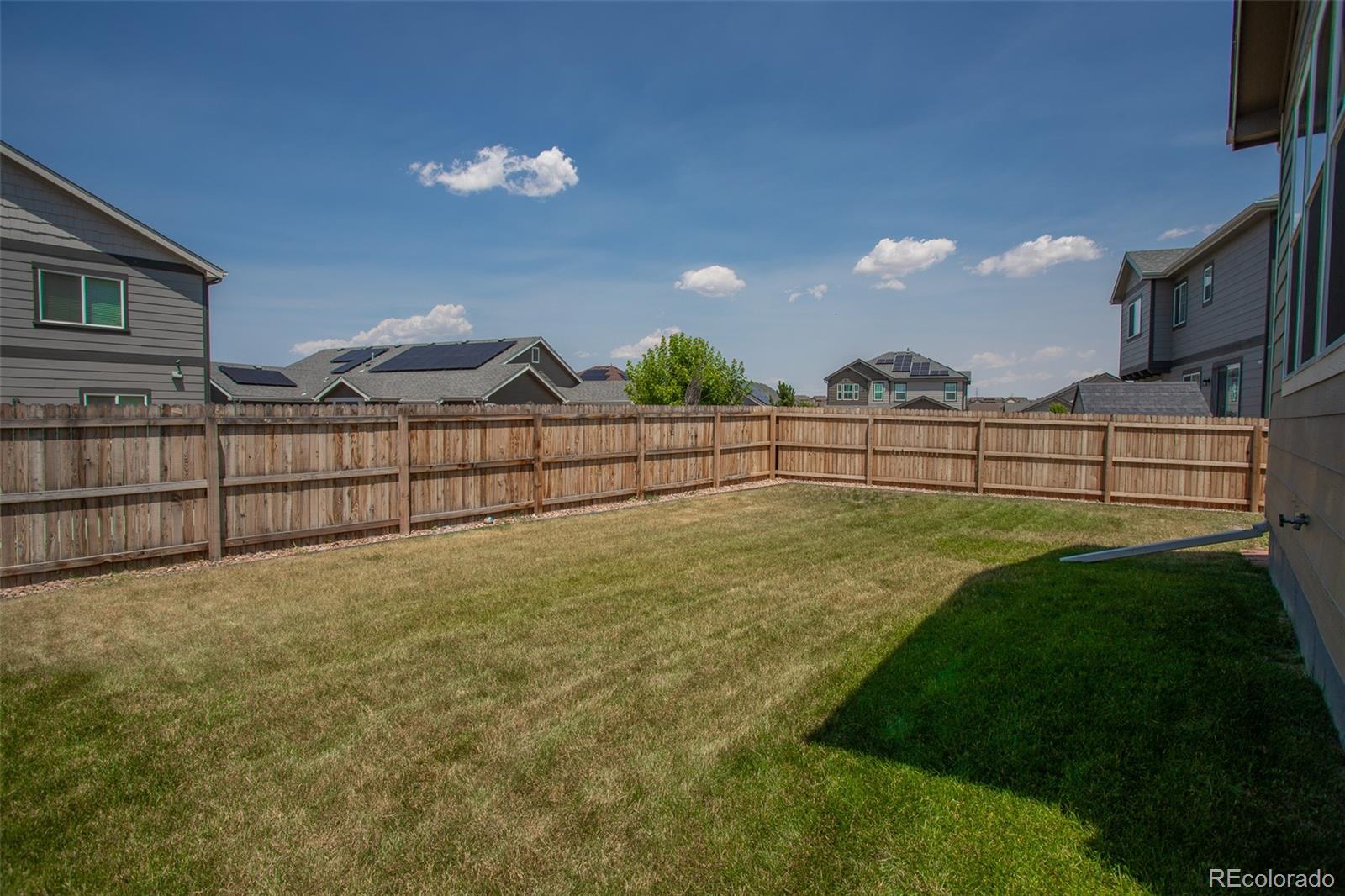16343 East 100th Way Commerce City, CO 80022 - Photo 35 of 38 a view of outdoor space and yard