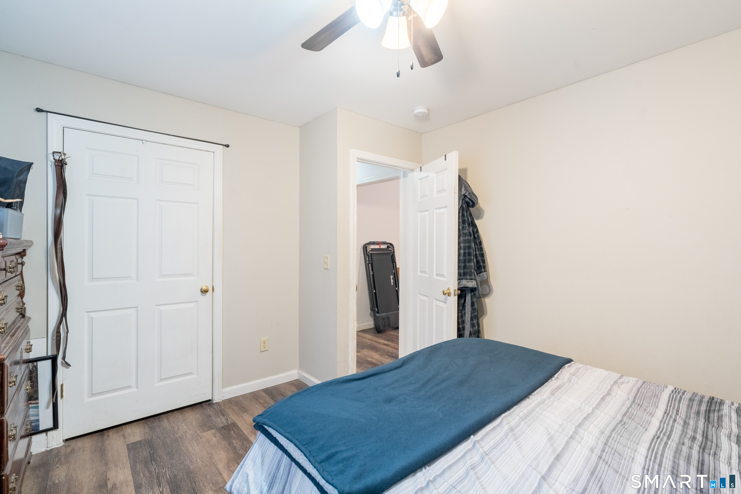 379 Christian Hill Road Brooklyn, CT 06234 - Photo 24 of 40 a bedroom with a bed and a chandelier
