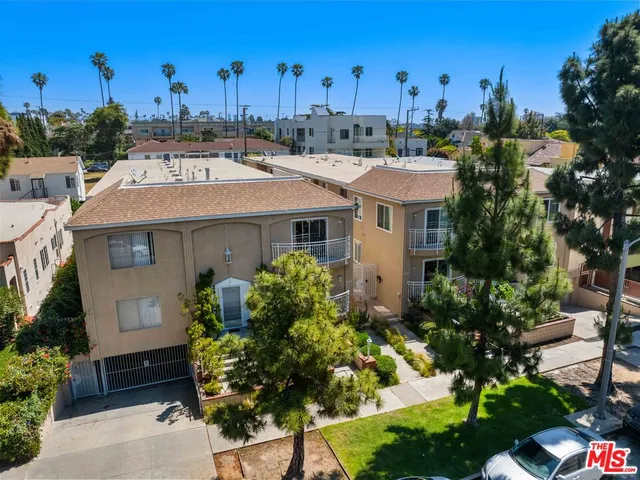 a aerial view of a house with a yard and plants