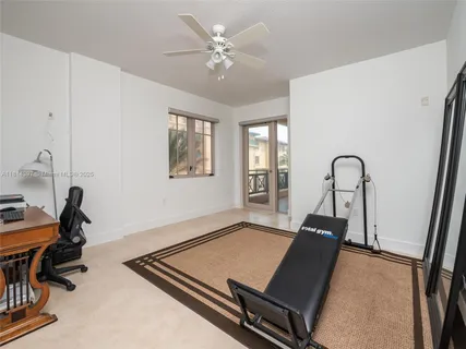 a room with gym equipment and a large window