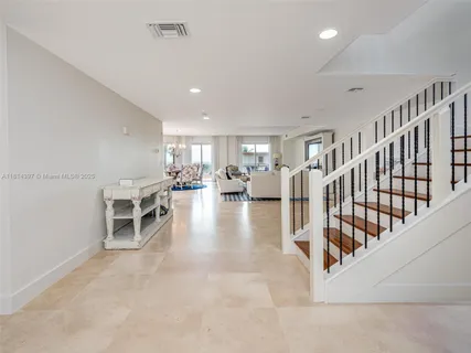 a view of a living room a dining room with furniture