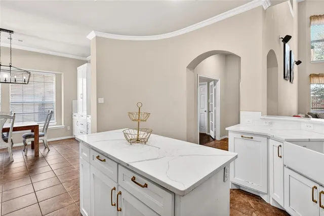 a kitchen with a sink and cabinets
