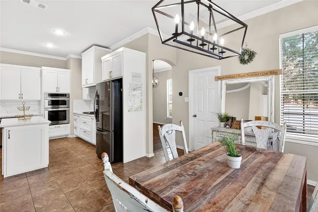 a bathroom with a sink a mirror a vanity and shower
