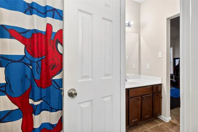 a bathroom with a sink a toilet and bathtub