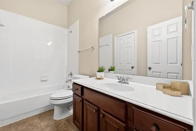 a backyard of a house with a tree